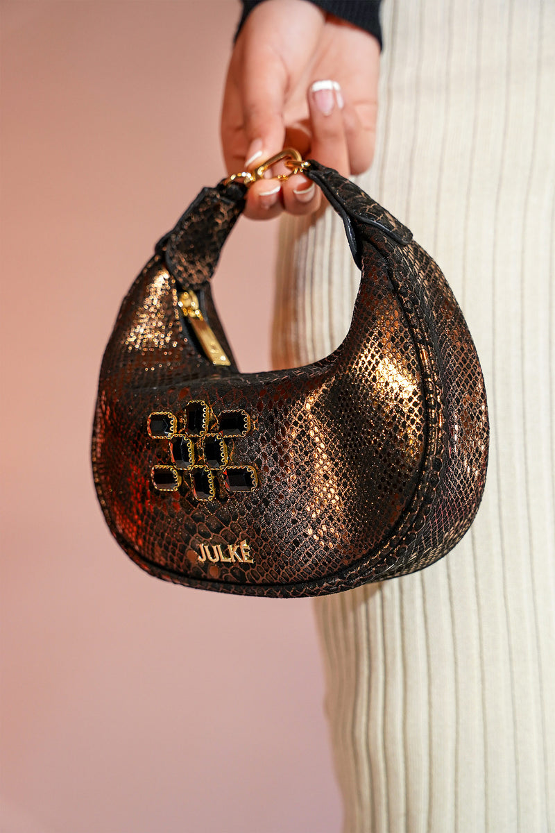 Women's leather mini hobo bag in copper black colour with 3d reptile texture and unique clip-on handle by JULKE 