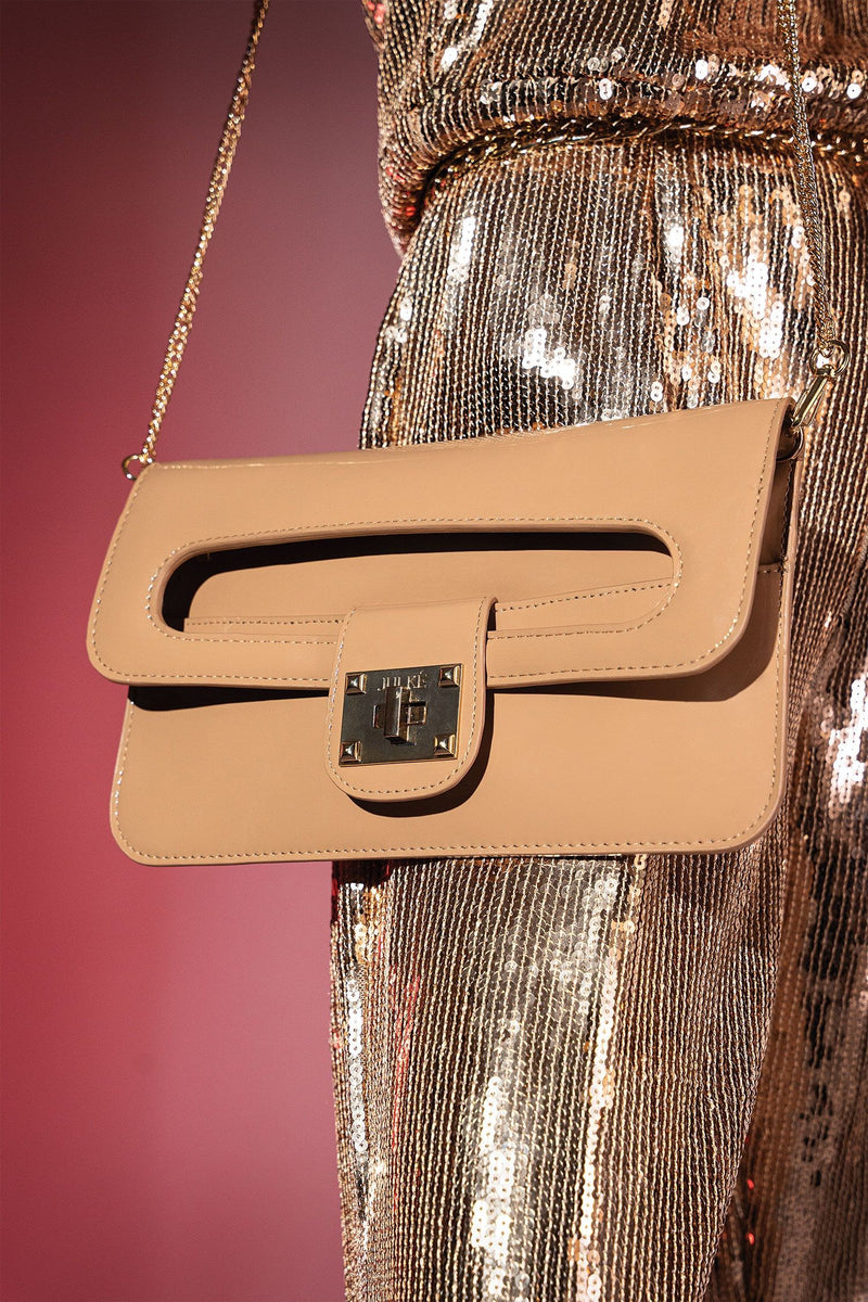 Womens patent leather clutch bag in beige colour with twist lock and detachable gold chain strap by JULKE