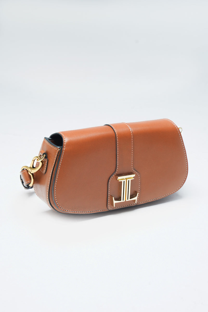 Womens leather shoulder baguette bag in medium brown colour with gold metal logo and hardware by JULKE