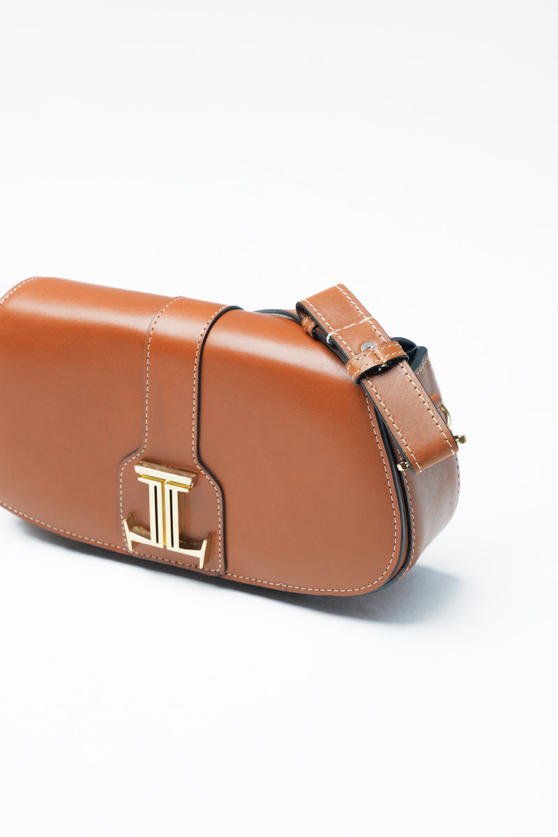 Womens leather shoulder baguette bag in medium brown colour with gold metal logo and hardware by JULKE