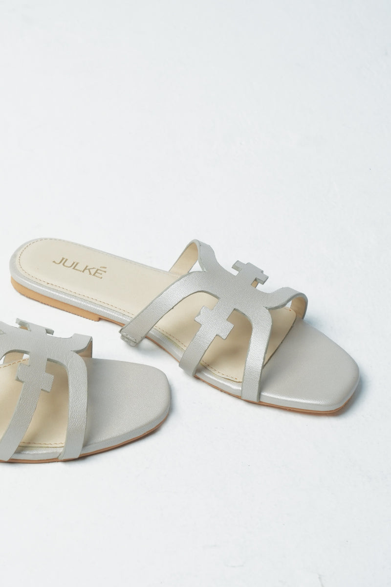 Womens leather flats in off white colour with laser cut strap by JULKE 