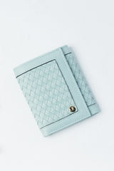 Womens leather trifold wallet in light blue colour with braiding and metal logo by JULKE