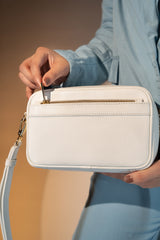 Women's leather crossbody bag in white colour with round rectangle shape and detachable shoulder strap by JULKE