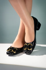 Womens leatherite block heel shoes in black colour with golden horsebit buckle by JULKE