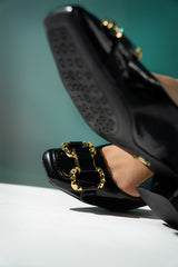 Womens leatherite block heel shoes in black colour with golden horsebit buckle by JULKE