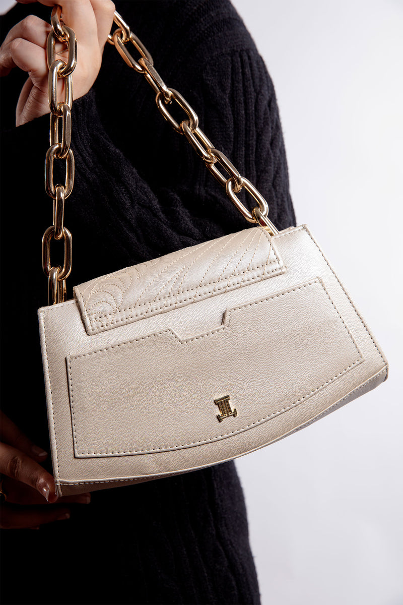 Womens leather shoulder bag in beige colour with flower buckle and golden chain by JULKE