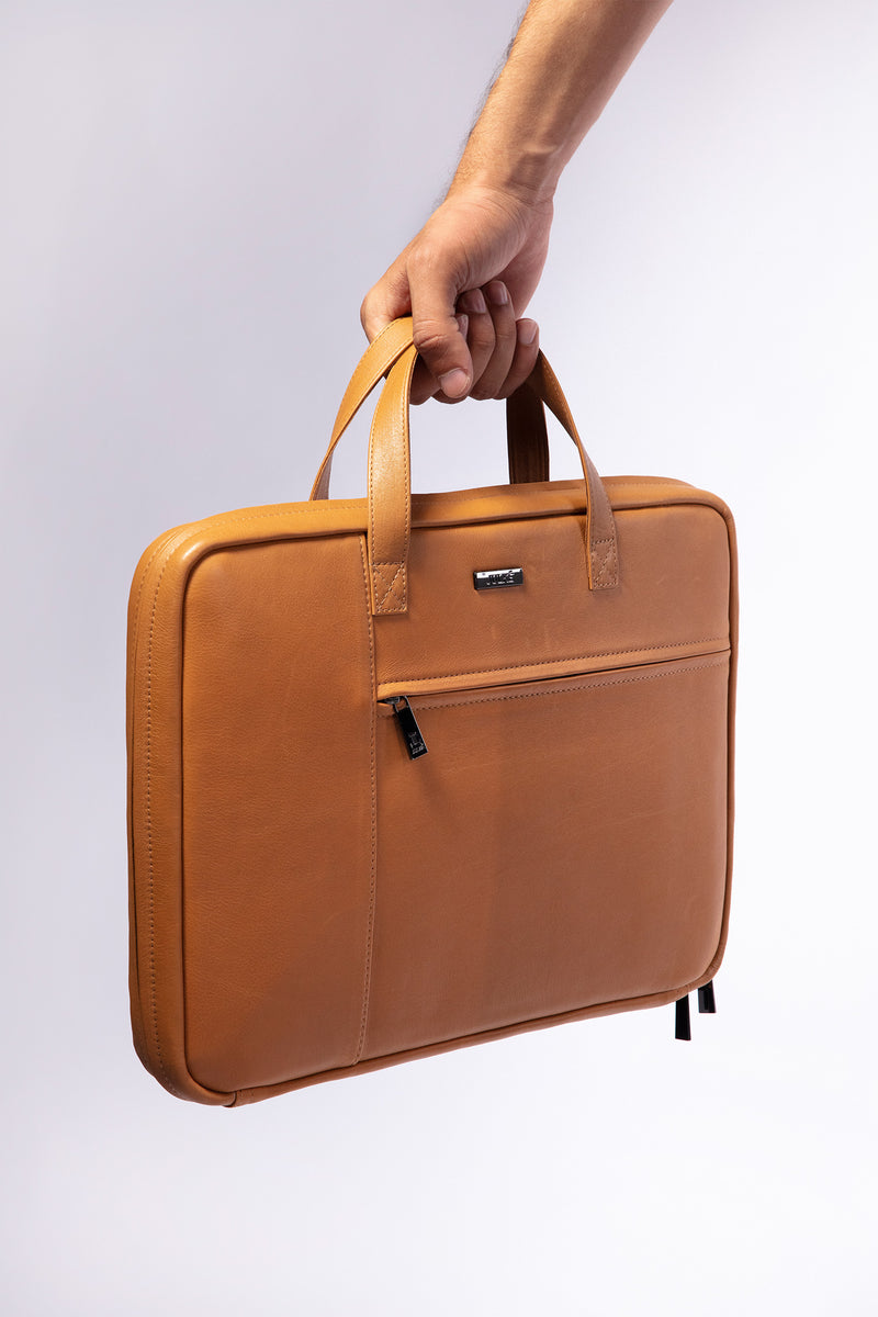 Leather laptop sleeve in light brown colour with top handle by JULKE