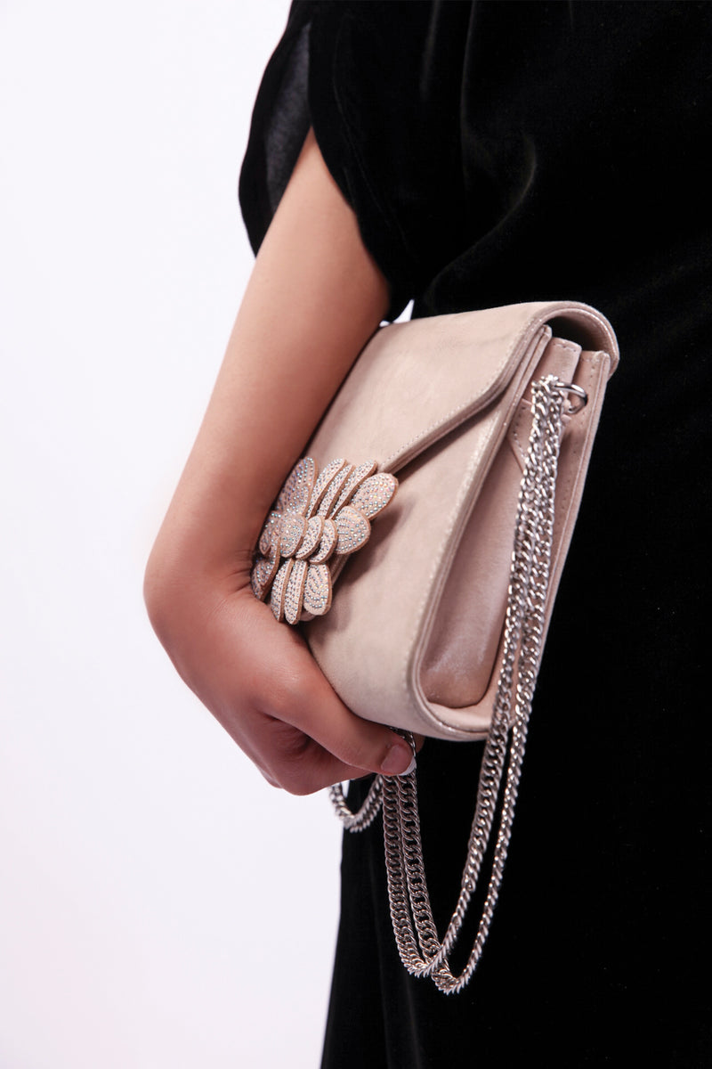 Womens leather shoulder clutch bag in light pink colour with diamante leaf brooch and silver chain by JULKE