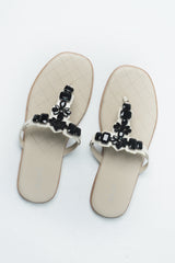 Women summer flat shoes in thong style in off white colour with black rhinestones by JULKE