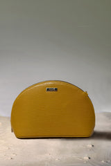 Women's leather travel makeup pouch in mustard yellow colour in semi-circle shape with detachable chain strap by JULKE