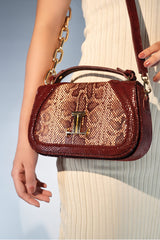 Women's leather top handle shoulder bag in dark red colour with snake print & texture by JULKE 