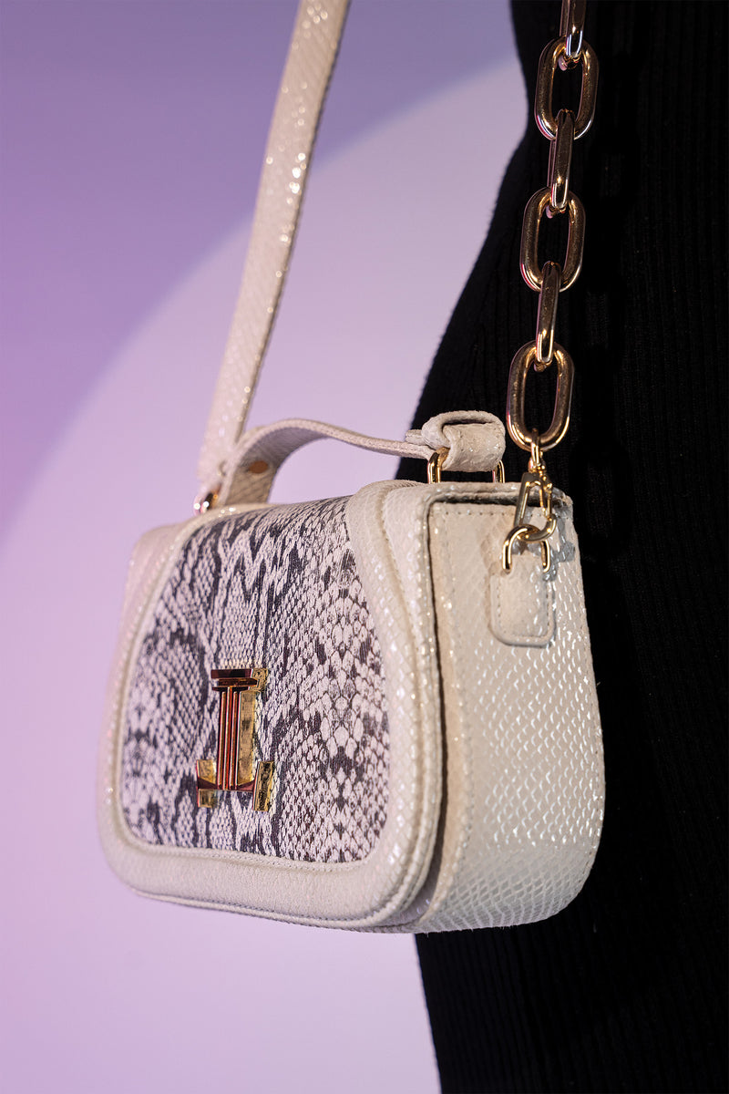 Women's leather top handle shoulder bag in white colour with snake print & texture by JULKE 