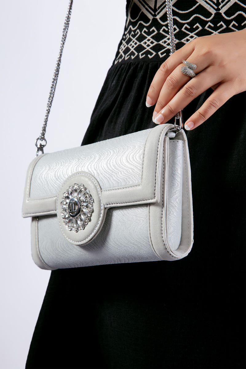 Womens leather shoulder bag and clutch in silver colour with flower diamante brooch by JULKE