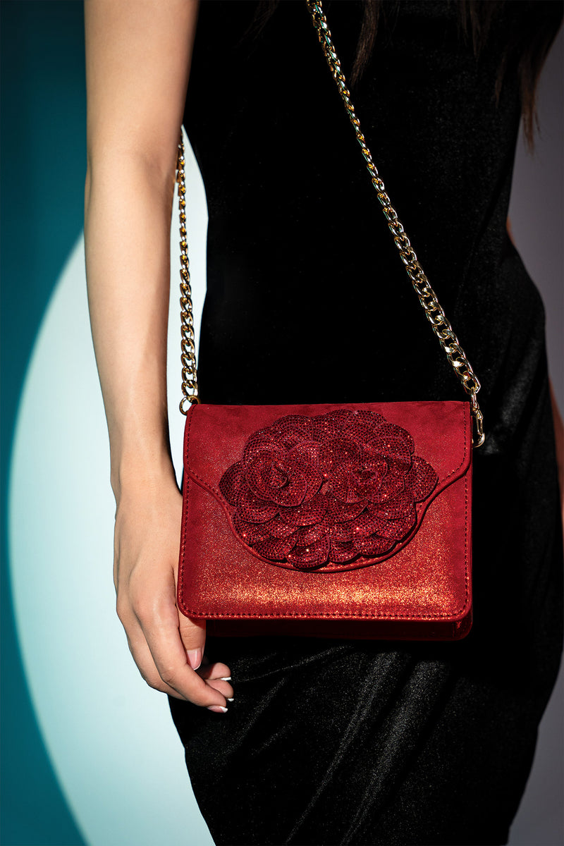 Womens suede leather shoulder bag in red glitter colour with big diamante flower brooch and detachable golden chain by JULKE