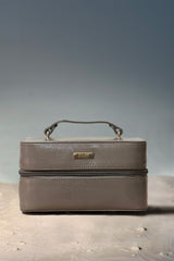 Women's leather travel bag in grey colour for accessories and makeup in square shape with top handle by JULKE