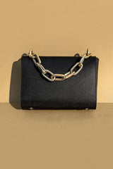 Women's leather top handle bag in black colour with accordion gusset and golden chain handle by JULKE