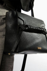 Womens soft leather shoulder bag in black colour with top handle and weaving strap by JULKE