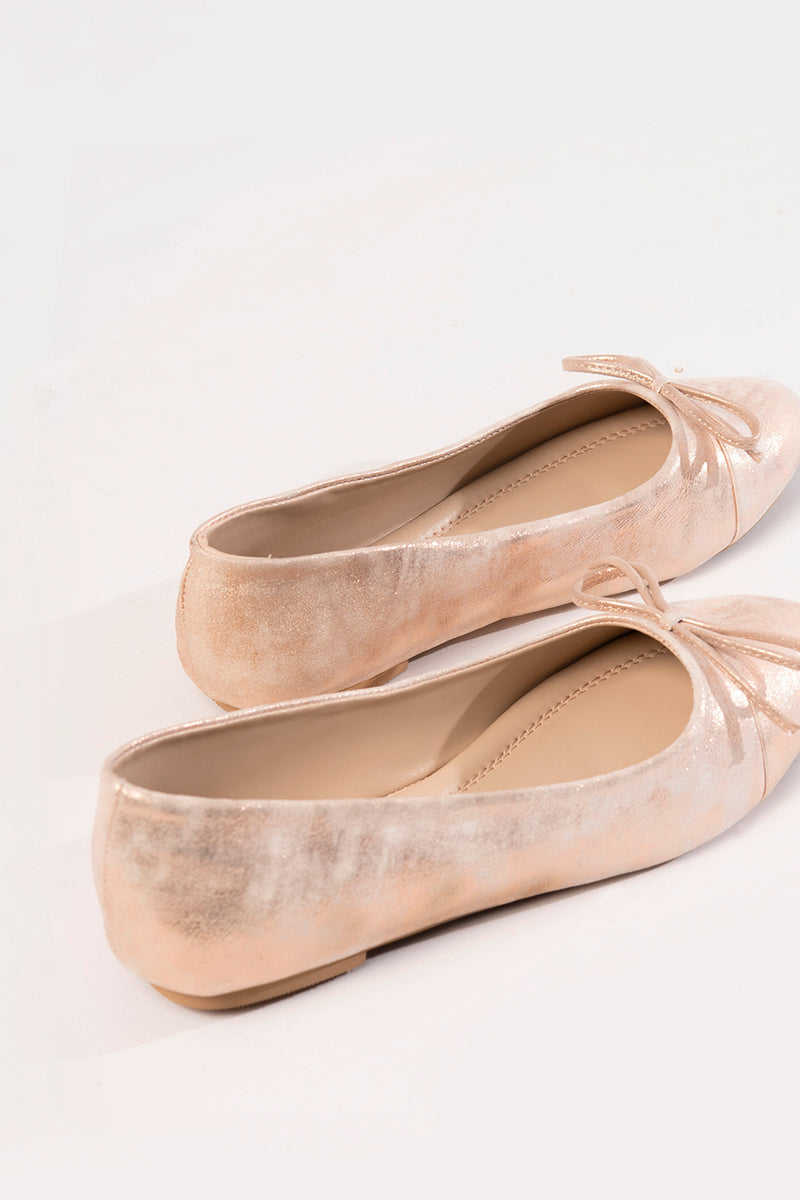 Womens leather flat ballerina pumps in light pink colour with shiny texture and bow by JULKE 