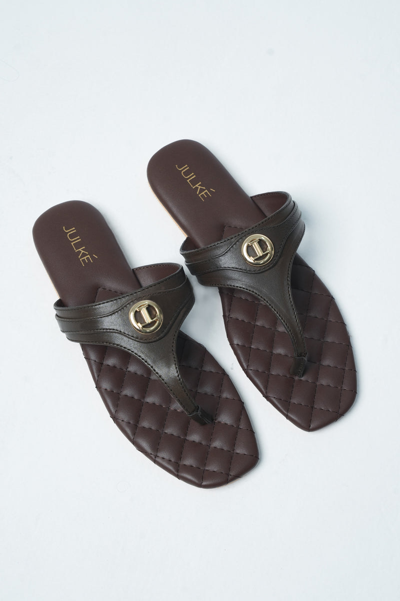 Womens leather flat thongs in dark brown colour with quilted insock and metal logo by JULKE