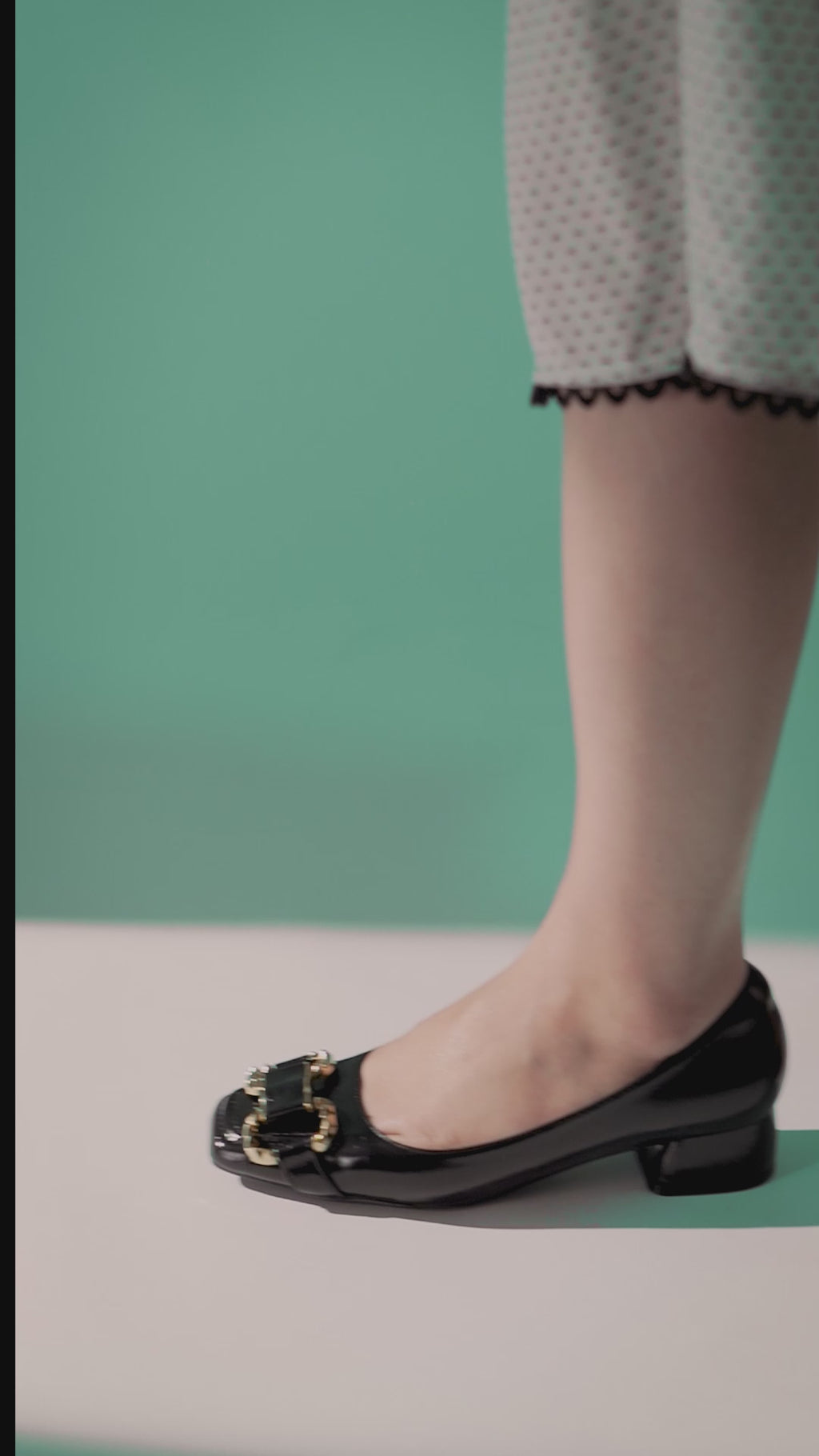 Womens leatherite block heel shoes in black colour with golden horsebit buckle and matching bag by JULKE